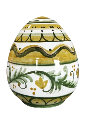 Uovo scatola in ceramica maiolica lucida con decori tradizionali siciliani nei toni del verde pistacchio e oro caldo, foglie stilizzate e fiori gialli. Interamente fatto a mano a Bronte da Arte&Decoro. Arredamento design fatto in Italia, utile e adatto come centrotavola pasqua.