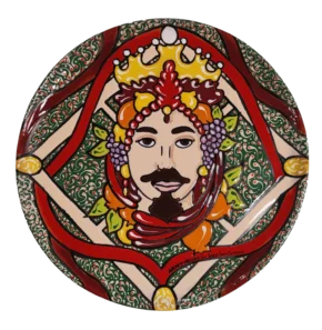 Piatto in ceramica siciliana decorato in cuerda seca raffigurante la Testa di Moro uomo con baffi e corona